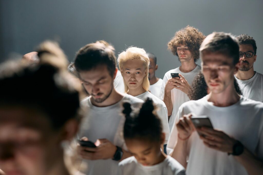 group of people looking at mobile phones